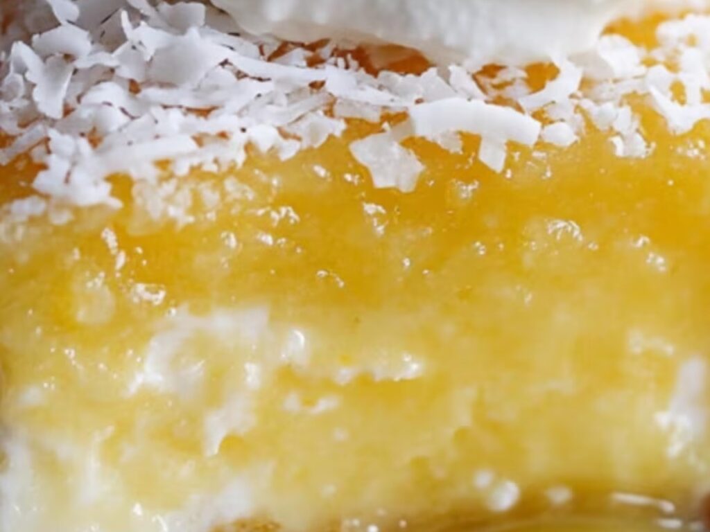 A moist lemon cake layered with coconut cream and lemon zest.